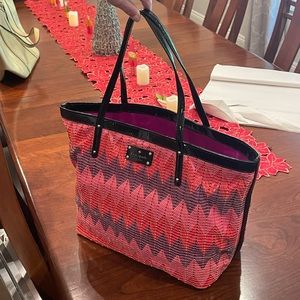 Kate Spade purse in purple and pink zig zag colors. Unique texture. Black trim.